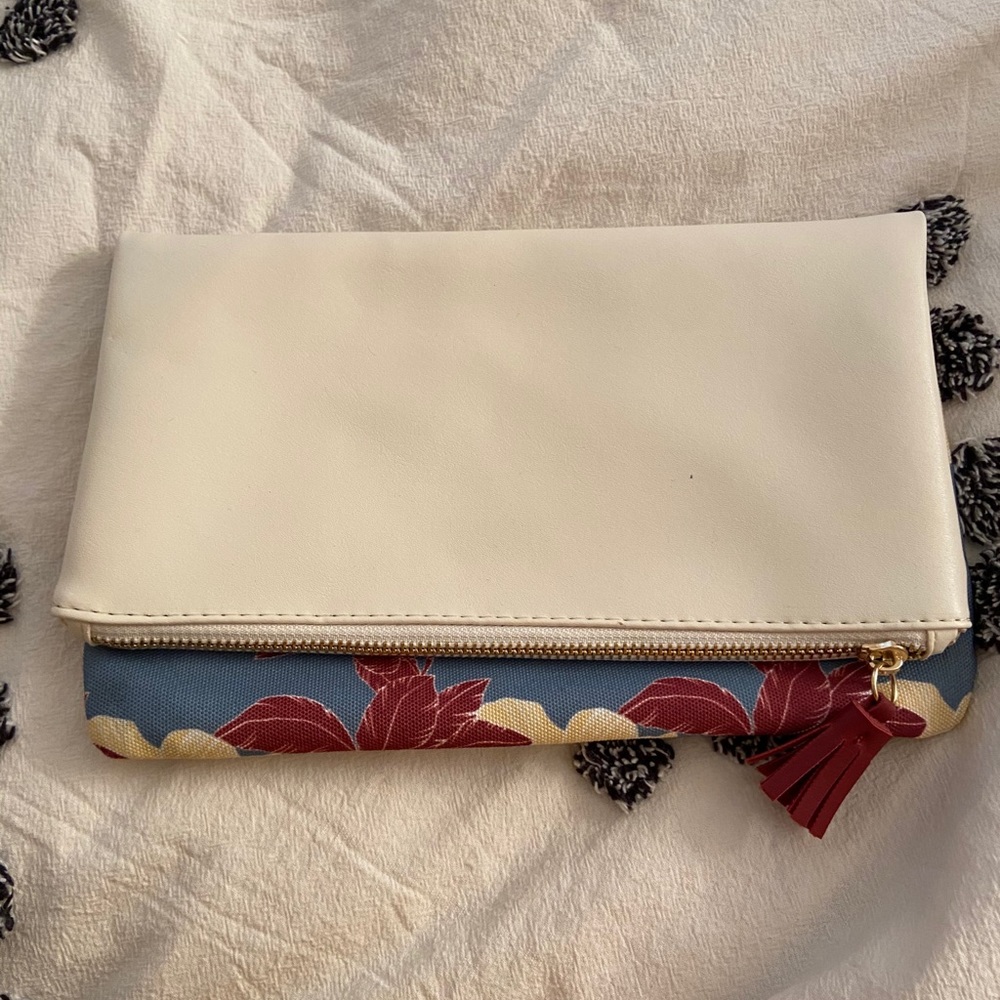 Reversible cream and floral clutch